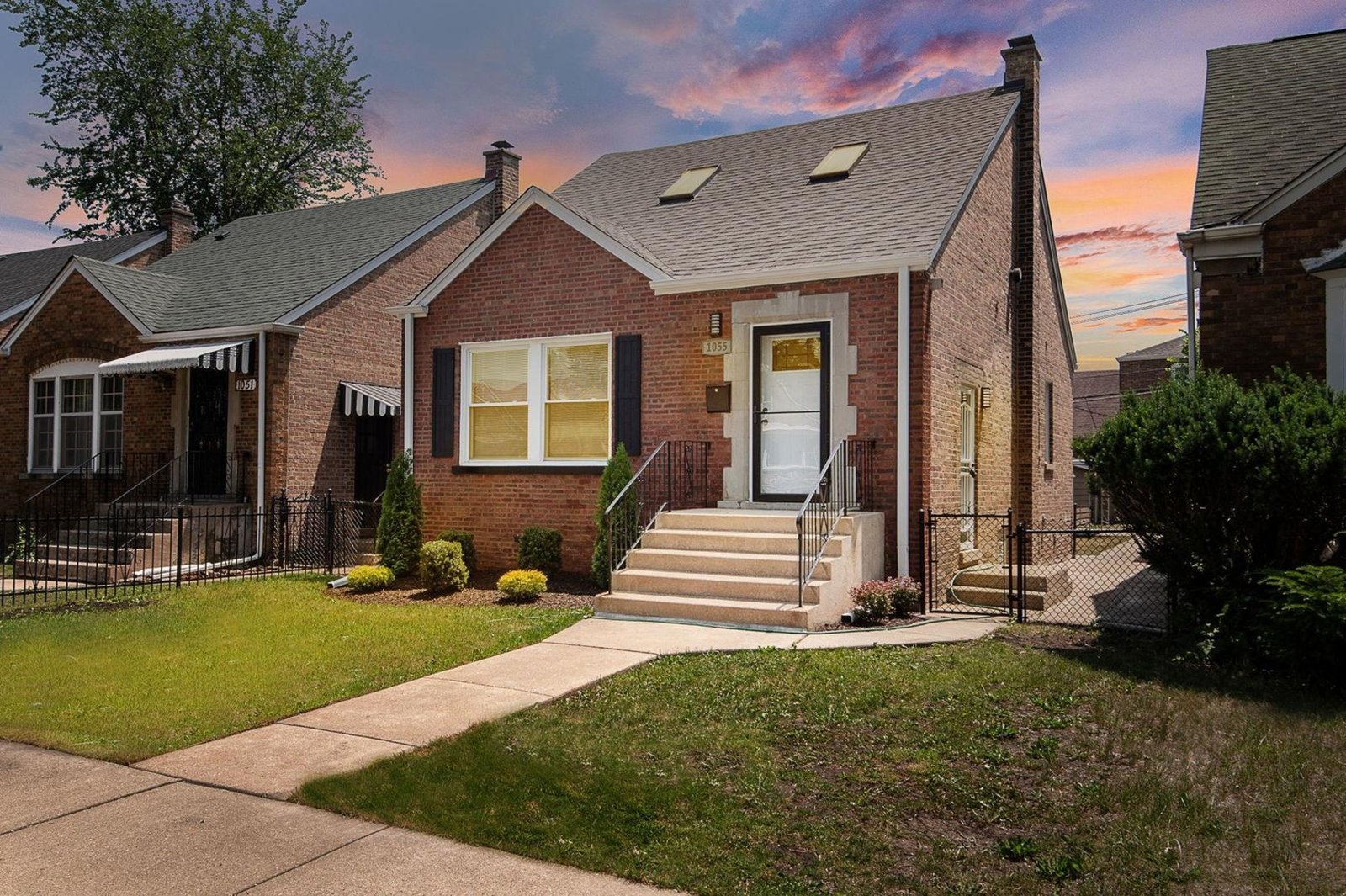Sold home at 1055 W 93rd St, Chicago, a red brick house with front steps and a landscaped yard